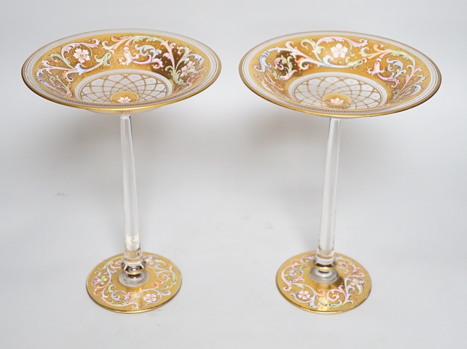 A fine pair of Bohemian enamelled glass tall pedestal bonbon dishes, probably Moser, late 19th century, 25.5 cm high, dish tops 18.5 cm diameter